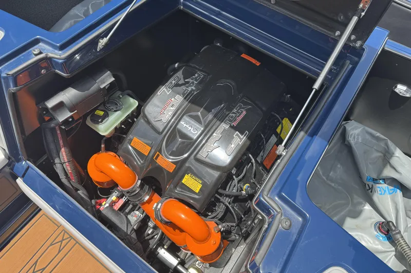 Slide: The Image of 2021 Tigé 23ZX boat engine compartment with powerful inboard motor and components. - 15