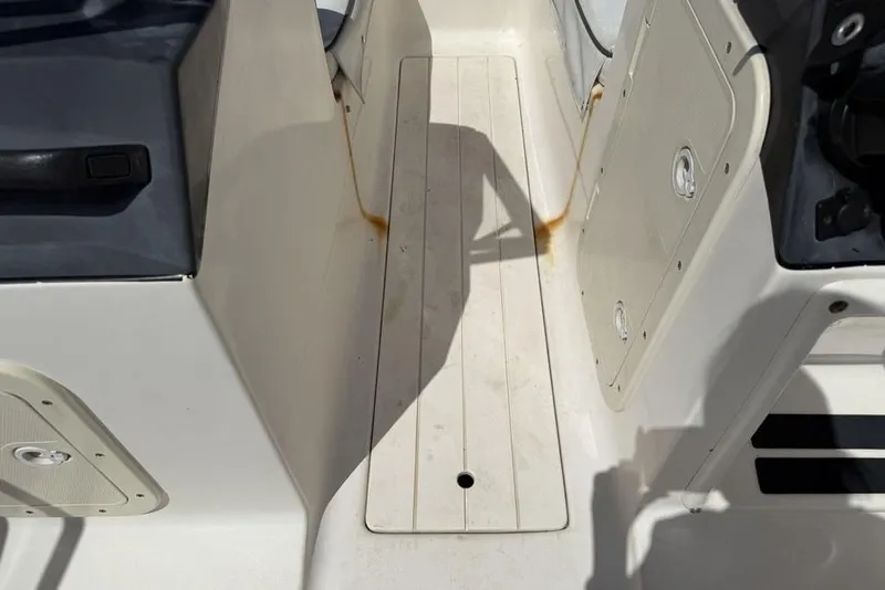 Slide: The Image of 1994 Seaswirl 192 Striper boat interior showing seating and storage compartments. - 12