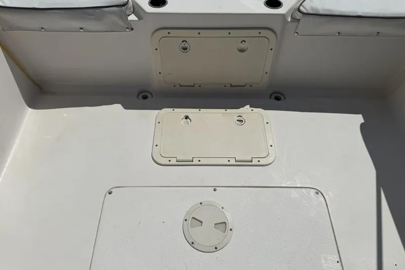 Slide: The Image of Deck view of a 1994 Seaswirl 192 Striper boat with storage compartments. - 15