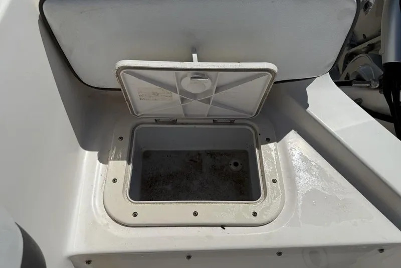 Slide: The Image of Open storage compartment on a 1994 Seaswirl 192 Striper boat. - 21