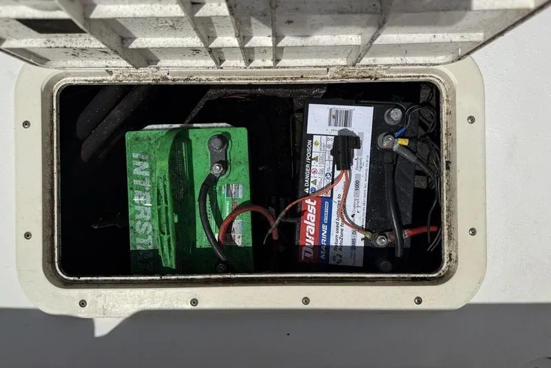 Slide: The Image of Battery compartment of a 1994 Seaswirl 192 Striper with Interstate and Duralast marine batteries. - 22