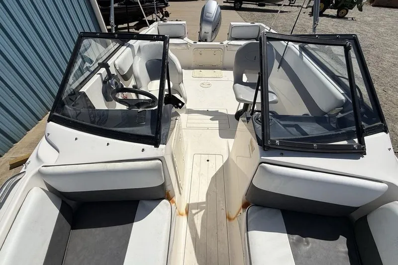 Slide: The Image of 1994 Seaswirl 192 Striper boat interior with seating and steering wheel. - 27
