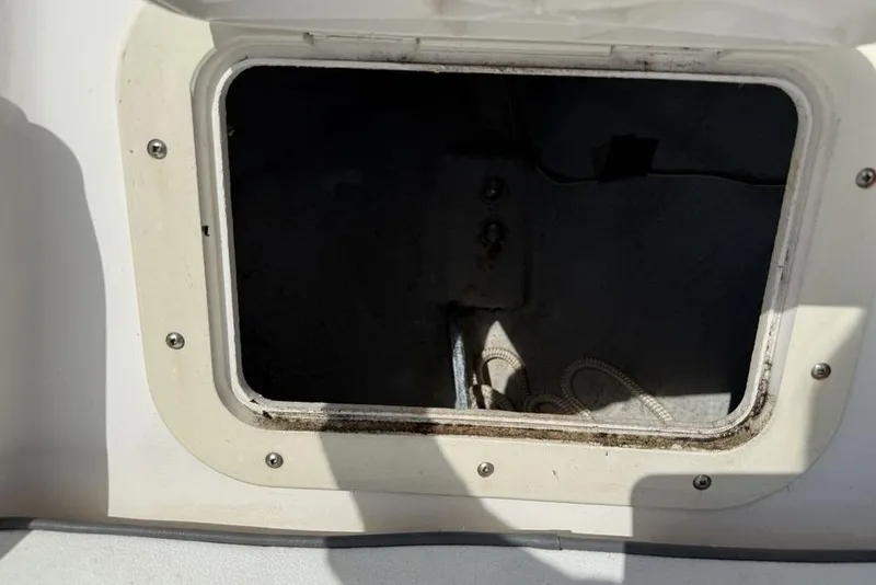 Slide: The Image of Open storage compartment on a 1994 Seaswirl 192 Striper boat. - 8
