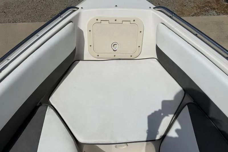 Slide: The Image of Bow seating area of a 1994 Seaswirl 192 Striper boat with storage compartment. - 9