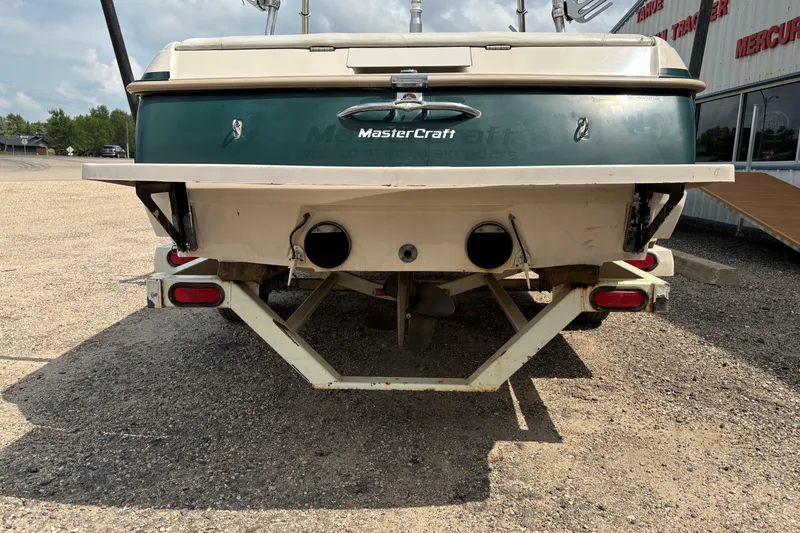 Slide: The Image of Rear view of a 1999 MasterCraft 205 PRO STAR boat on a trailer. - 6