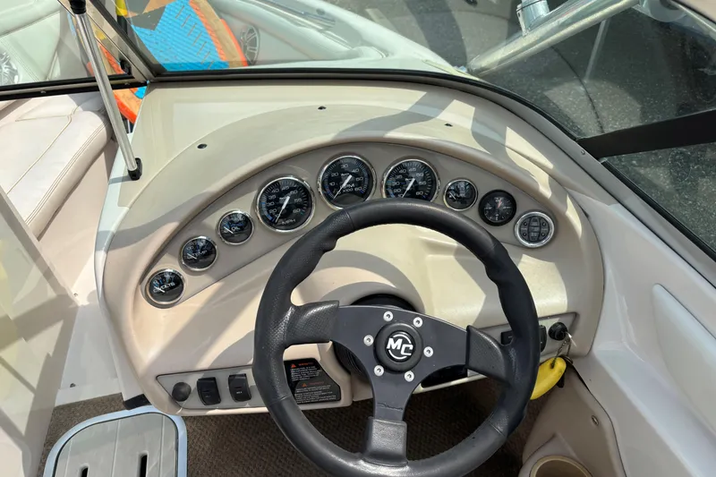 Slide: The Image of 1999 MasterCraft 205 PRO STAR dashboard with steering wheel and gauges. - 7