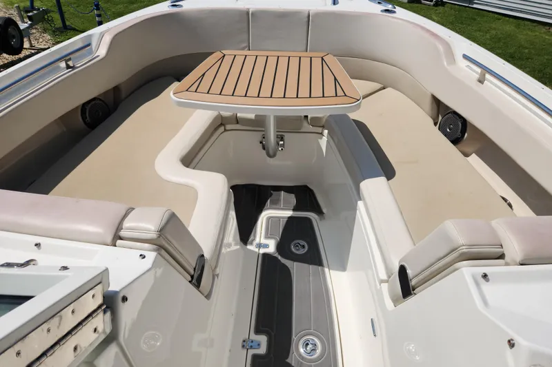 Slide: The Image of 2018 Boston Whaler 320 Vantage boat interior with seating and table. - 18