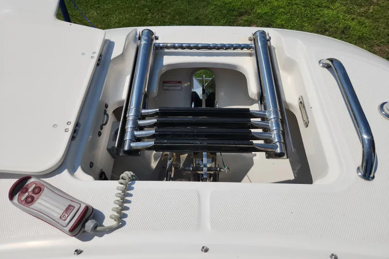 Slide: The Image of 2018 Boston Whaler 320 Vantage boat ladder and control panel on deck. - 19