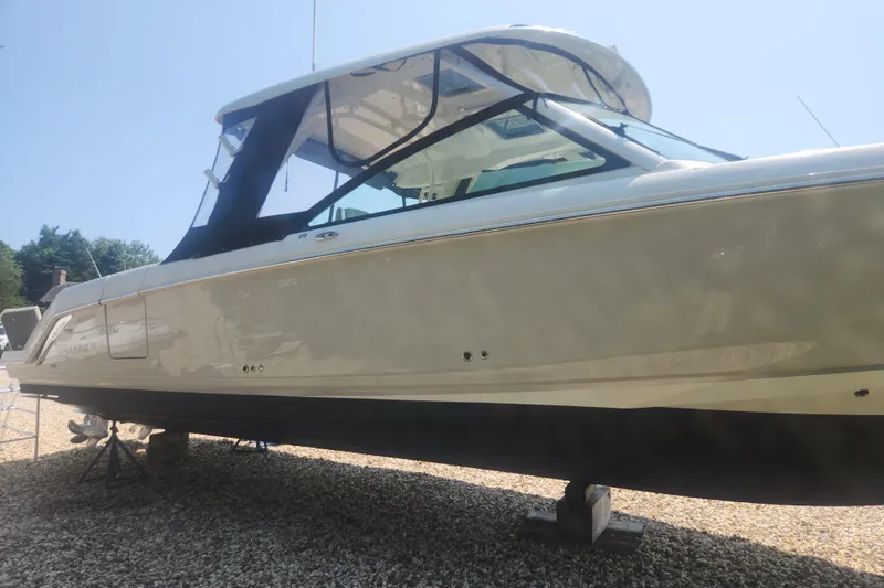 Slide: The Image of 2018 Boston Whaler 320 Vantage boat on display, side view. - 21