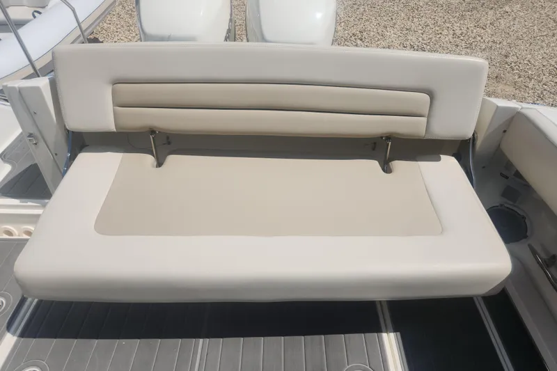 Slide: The Image of 2018 Boston Whaler 320 Vantage boat seat, beige upholstery, outdoor setting. - 4