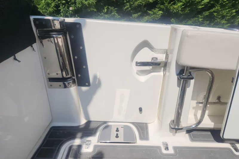 Slide: The Image of 2018 Boston Whaler 320 Vantage boat interior, featuring stainless steel fixtures and a sleek design. - 5