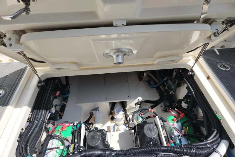 Slide: The Image of 2018 Boston Whaler 320 Vantage engine compartment, showcasing detailed wiring and components. - 6