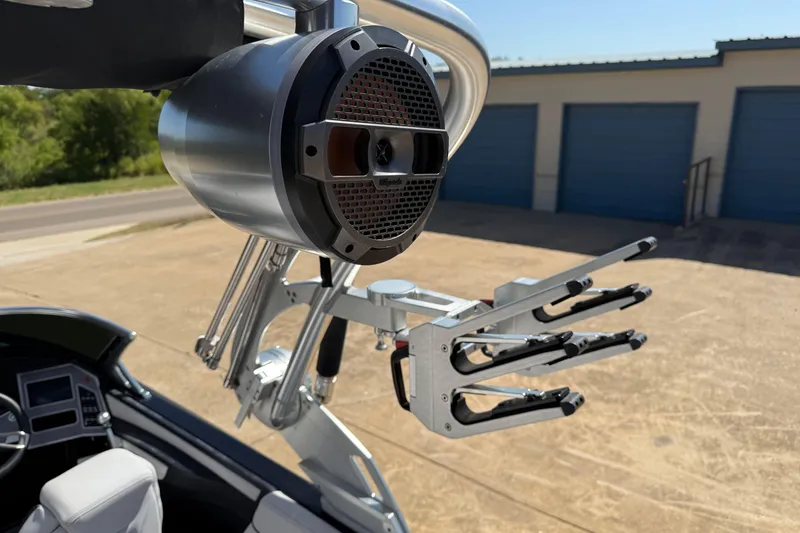 Slide: The Image of 2020 MasterCraft XT25 boat with mounted speaker and wakeboard rack. - 17