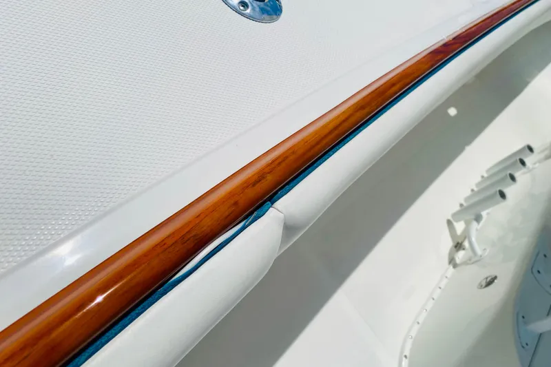 Slide: The Image of Close-up of Venture 39 Open boat's polished faux teak detailing. - 13