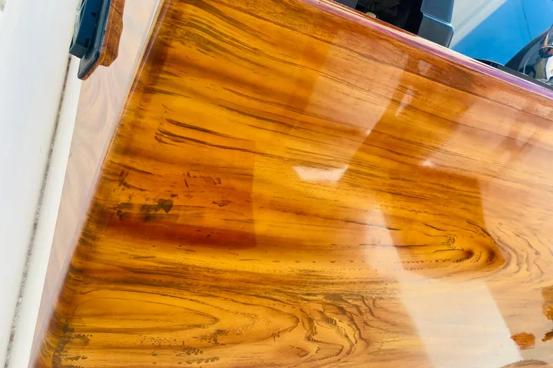 Slide: The Image of Close-up of Venture 39 Open boat's polished faux teak details - 14