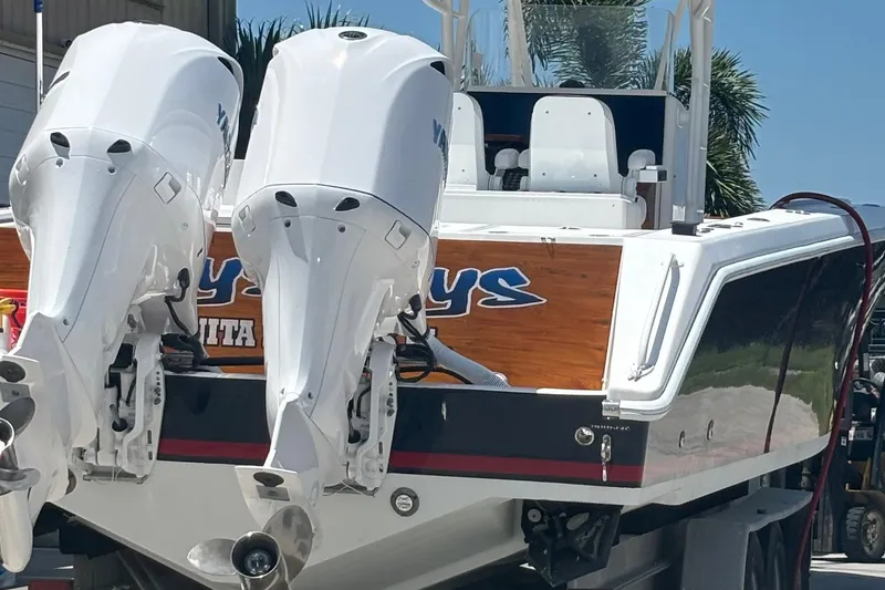 Slide: The Image of 2005 Venture boat with dual outboard motors on a trailer. - 21