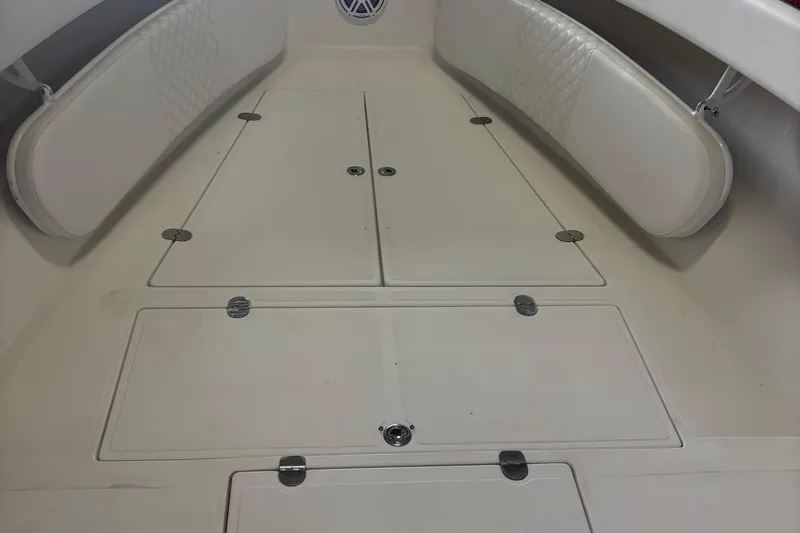 Slide: The Image of 2005 Venture boat interior with cushioned seating and storage compartments. - 23