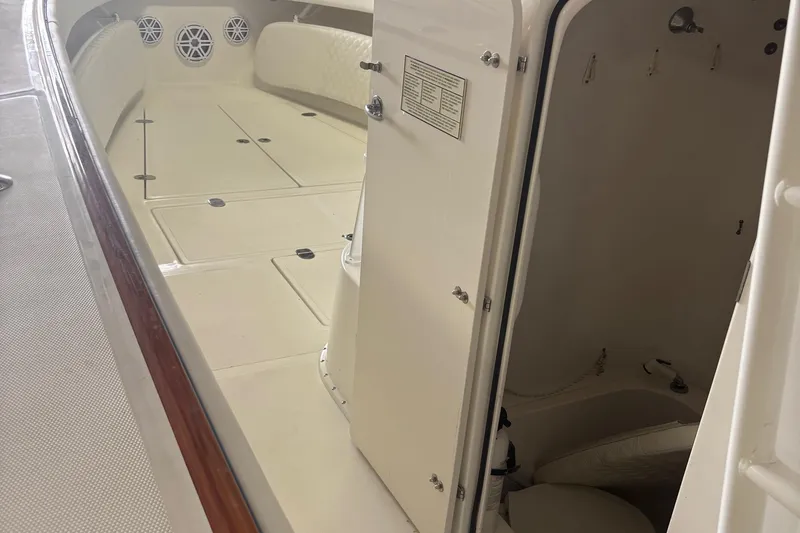 Slide: The Image of 2005 Venture boat interior with open cabin door and seating area. - 26