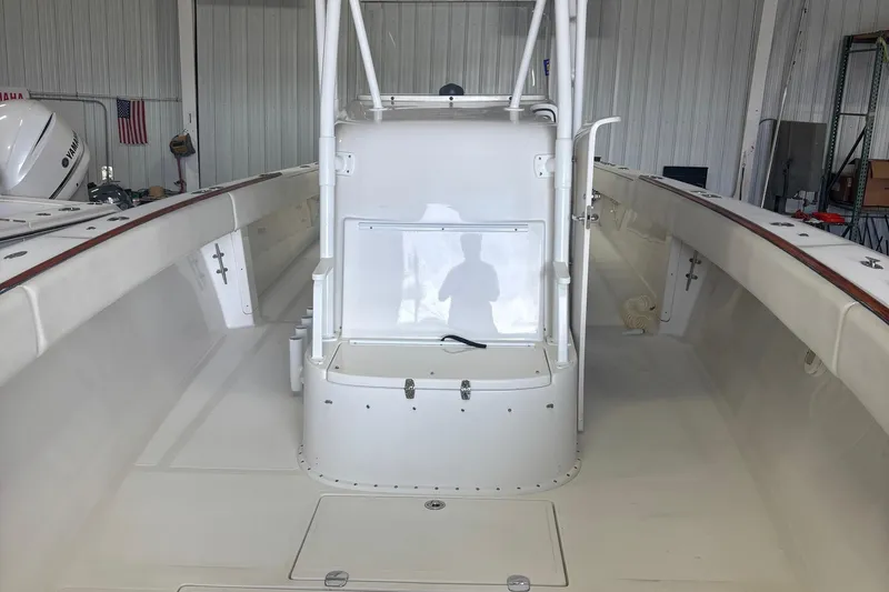 Slide: The Image of 2005 Venture boat interior with center console in a storage facility. - 29