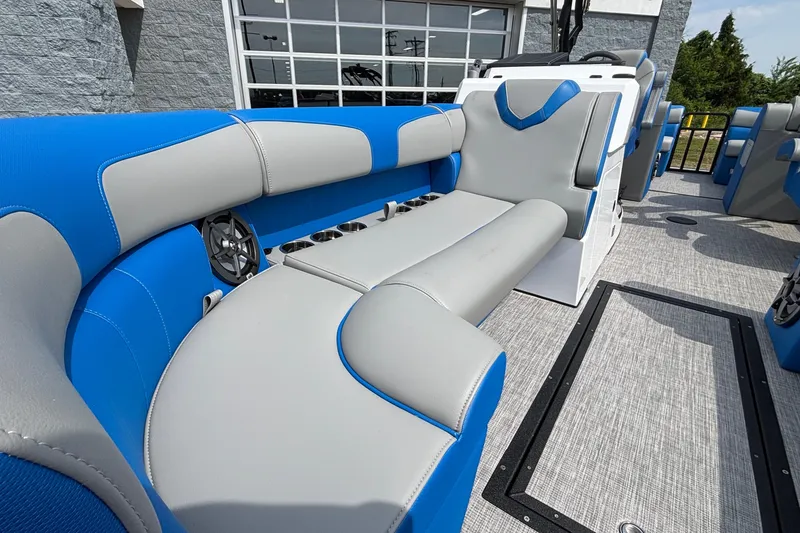 Slide: The Image of 2025 Montara 25 Surf Boss boat interior with blue and gray seating. - 13