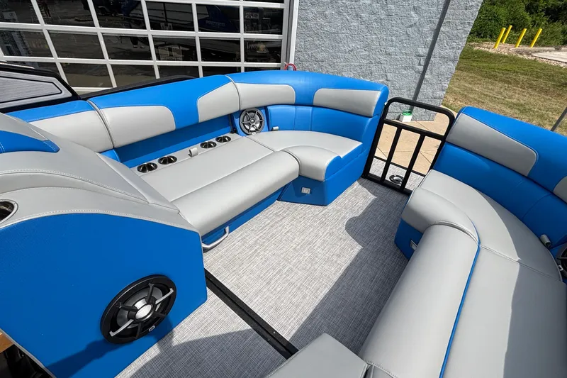 Slide: The Image of Interior of 2025 Montara 25 Surf Boss boat with blue and gray seating. - 20