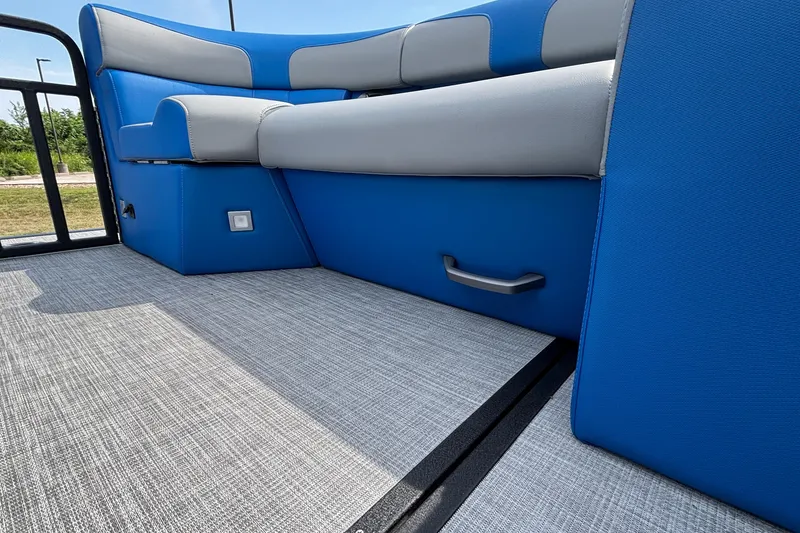 Slide: The Image of 2025 Montara 25 Surf Boss interior with blue and gray seating, textured flooring. - 27