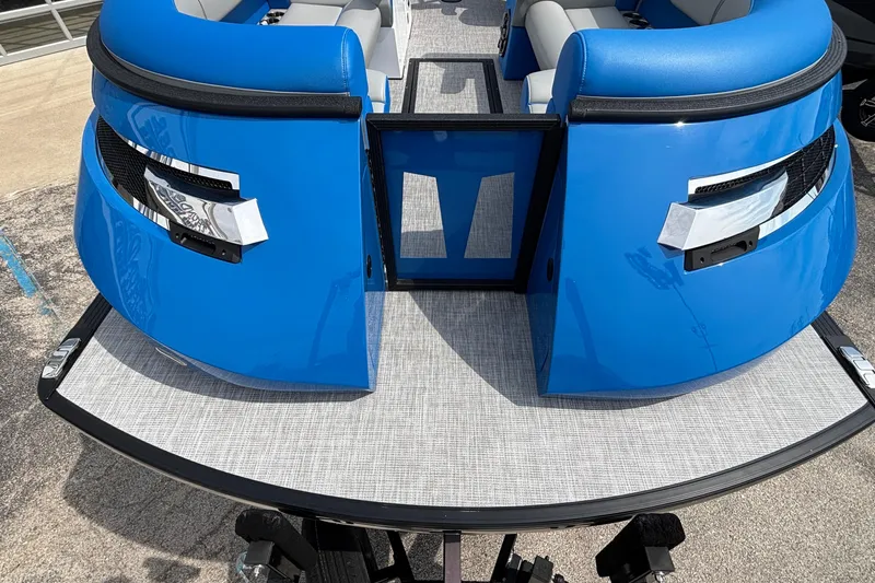 Slide: The Image of 2025 Montara 25 Surf Boss boat with blue exterior and open rear gate. - 28