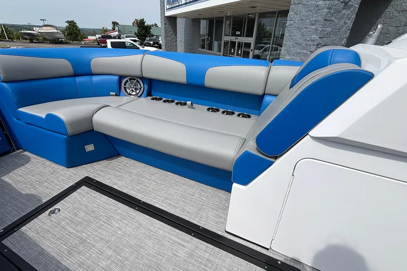 Slide: The Image of 2025 Montara 25 Surf Boss boat interior with blue and gray seating. - 8