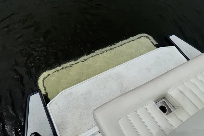 Slide: The Image of 2013 Cobalt A28 boat swim platform with water reflection. - 19