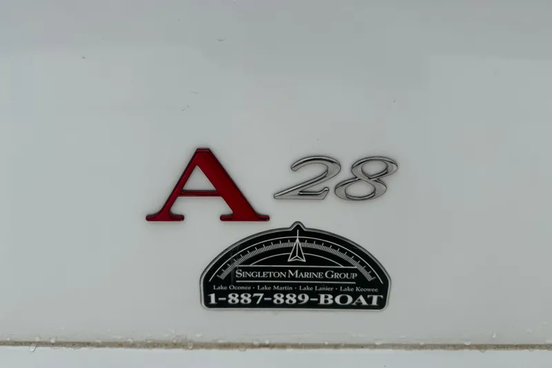 Slide: The Image of 2013 Cobalt A28 boat emblem with Singleton Marine Group contact information. - 38