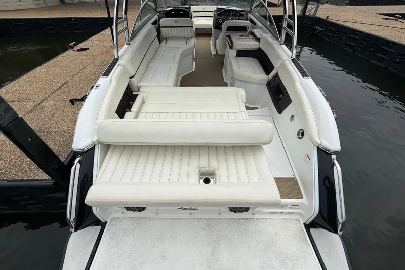 Slide: The Image of 2013 Cobalt A28 boat with spacious white seating and sleek interior design. - 43