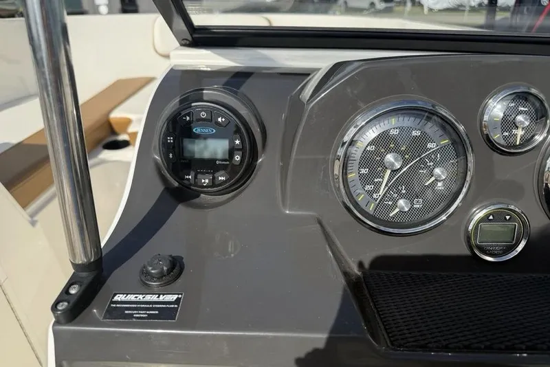 Slide: The Image of Dashboard of 2020 Bayliner VR4 Bowrider with gauges and controls. - 16