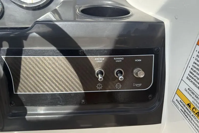 Slide: The Image of Control panel of 2020 Bayliner VR4 Bowrider with switches for anchor light, running light, and horn. - 18