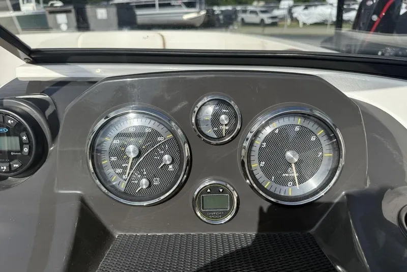Slide: The Image of Dashboard of a 2020 Bayliner VR4 Bowrider boat with gauges and controls. - 19