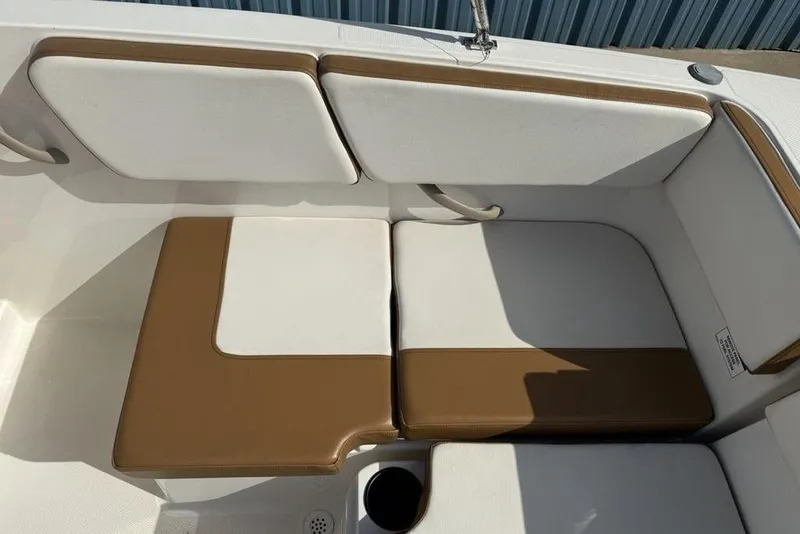 Slide: The Image of 2020 Bayliner VR4 Bowrider interior seating with brown and white upholstery. - 22