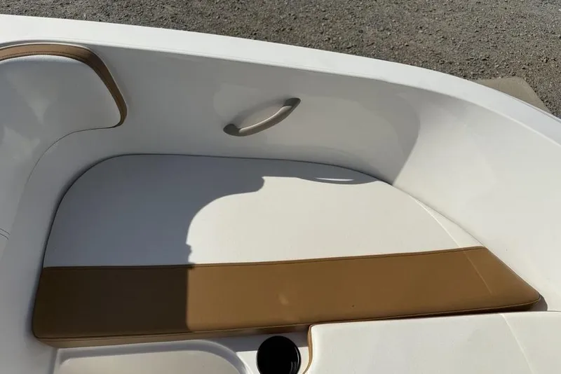 Slide: The Image of 2020 Bayliner VR4 Bowrider interior seating with tan and white upholstery. - 4
