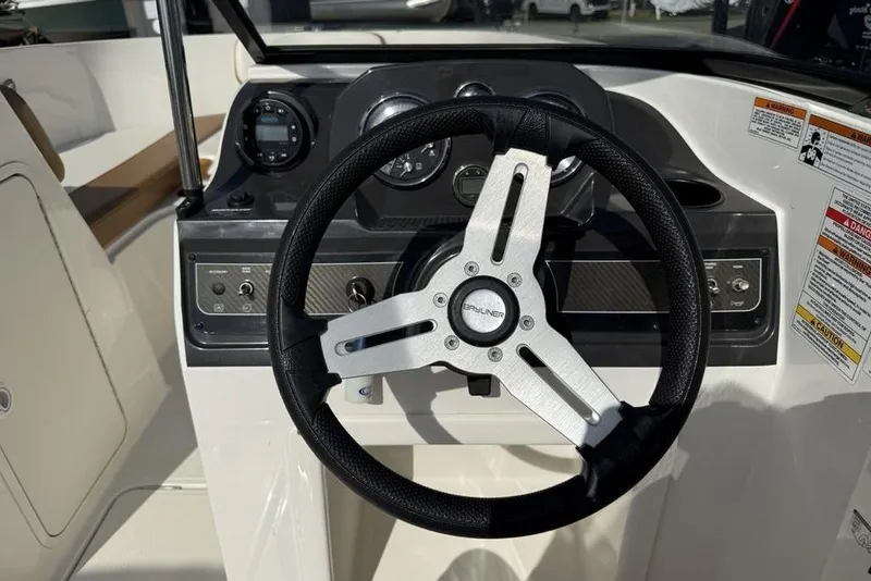 Slide: The Image of 2020 Bayliner VR4 Bowrider steering wheel and dashboard controls. - 6