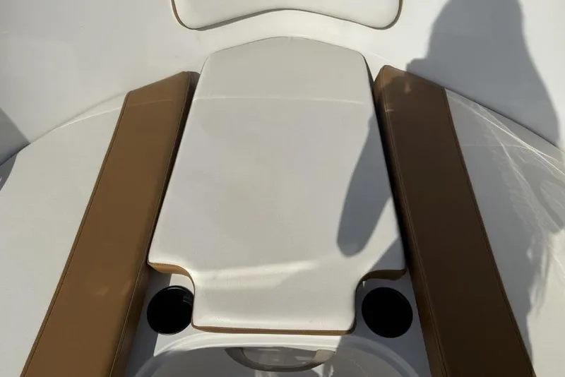 Slide: The Image of 2020 Bayliner VR4 Bowrider interior seating with brown and white upholstery. - 7