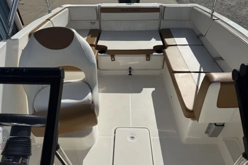Slide: The Image of 2020 Bayliner VR4 Bowrider interior with white and brown seating arrangement. - 8