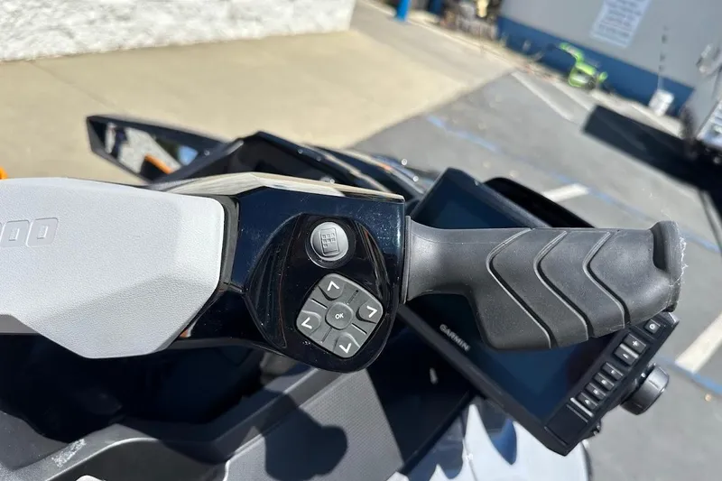 Slide: The Image of 2023 Sea-Doo Fish Pro Trophy handlebar with control buttons and display screen. - 13