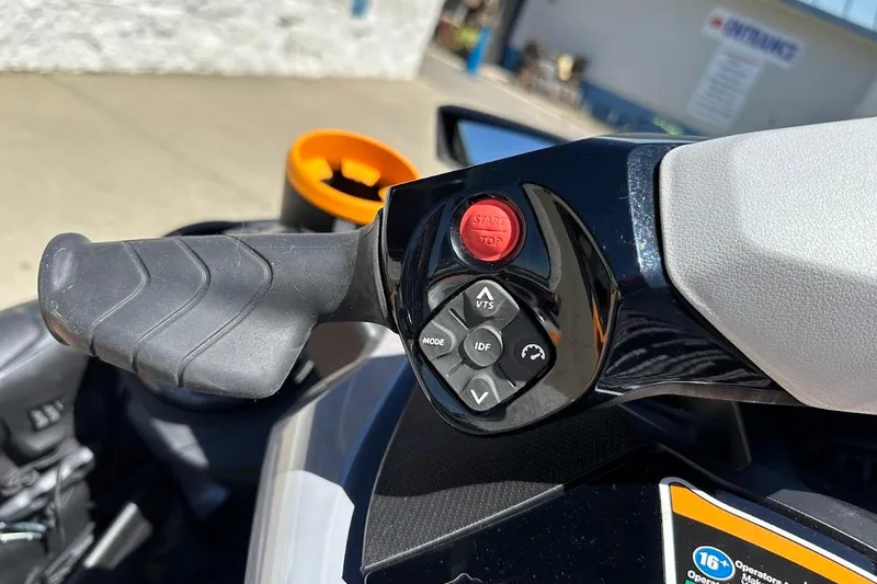 Slide: The Image of 2023 Sea-Doo Fish Pro Trophy handlebar controls with start/stop button and mode settings. - 14