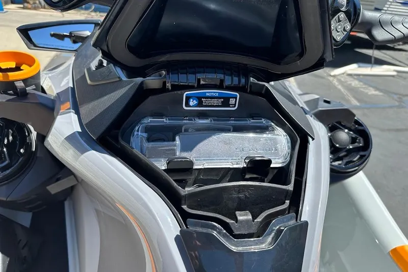 Slide: The Image of 2023 Sea-Doo Fish Pro Trophy dashboard with storage compartment open. - 17