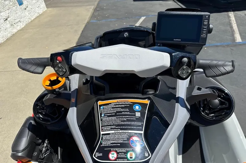 Slide: The Image of 2023 Sea-Doo Fish Pro Trophy dashboard with controls and Garmin display. - 18