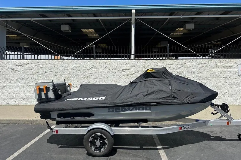 Slide: The Image of 2023 Sea-Doo Fish Pro Trophy on trailer, covered, parked outdoors. - 20