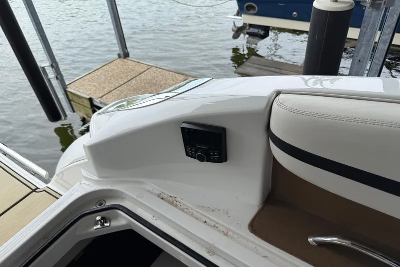 Slide: The Image of 2016 Cobalt R5 WSS Surf boat interior near dock, featuring control panel. - 13