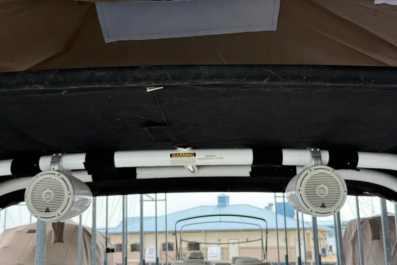 Slide: The Image of 2016 Cobalt R5 WSS Surf boat speakers and canopy interior view. - 14