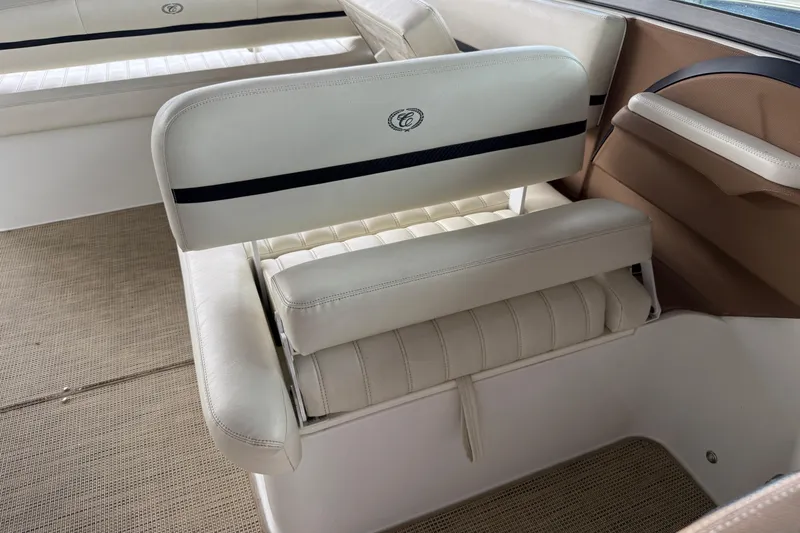 Slide: The Image of 2016 Cobalt R5 WSS Surf boat interior with white leather seating and beige accents. - 21