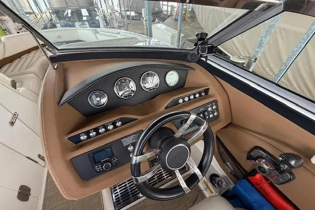 Slide: The Image of 2016 Cobalt R5 WSS Surf boat dashboard with steering wheel and control panel. - 30