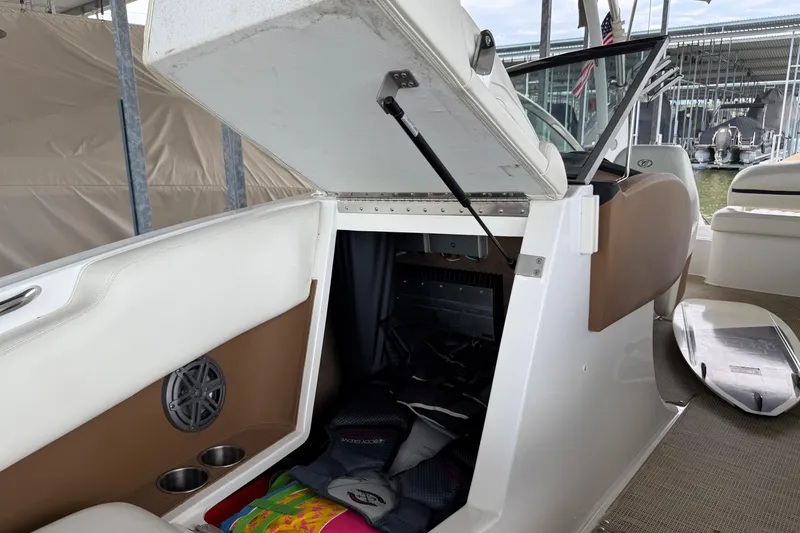Slide: The Image of 2016 Cobalt R5 WSS Surf boat interior storage compartment with open hatch. - 8