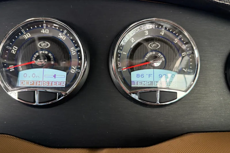 Slide: The Image of Dashboard of a 2016 Cobalt R5 WSS Surf boat showing speed and RPM gauges. - 9